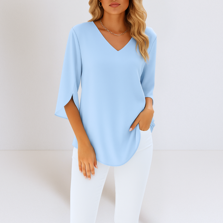 Stride™ - Elegant blus med V-ringning och slitsade ärmar